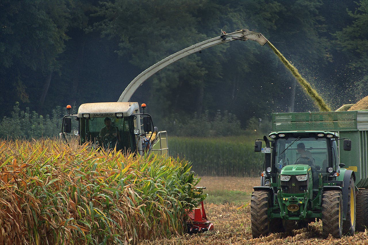 Green Tractor on Green Grass Field